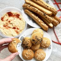 Vegan breads and grissini with sesame, sunflower seeds and oatmeal + homemade hummus with red pepper at Veg Mama Made in Yerevan