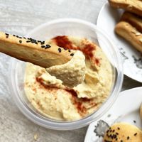 Vegan grissini with sesame, sunflower seeds and oatmeal +  homemade hummus with red pepper at Veg Mama Made in Yerevan