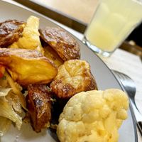 Baked potatoes with cauliflower in mustard sauce. It tastes like the day before yesterday, the vegetables are dry, the cauliflower is half-raw, very tough. Disappointing. at Art Lunch - Nalbandyan St in Yerevan