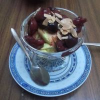 Delicious coconut cream dessert with stewed fruit. at The Food Temple in Lisbon