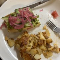 Avacado toast with home fries  at The Corner Restaurant in Milford