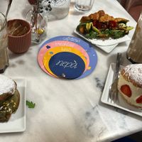 Caramel lattes, Maritozzo with pistachio and with strawberries+chantilly, savoury croissant   at Nepá in Milan