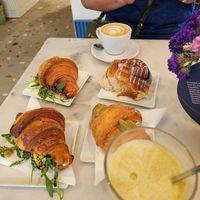 Croissant ensalada, cinnamon bun, pistacchio croissant, cappucino, and matche latte with espresso. at Nepá in Milan