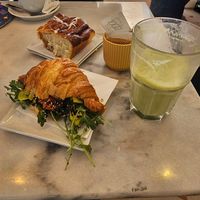 Cinnamon bun, crossaint salata, and matcha latte. at Nepá in Milan