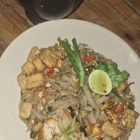 Tofu pad thai with vegan 'prawn' crackers at Benih Cafe in Kuta
