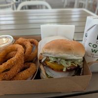 Mexicali burger, onion rings with chipotle mayo, and organic coconut water. at Nice Burger in Irvine