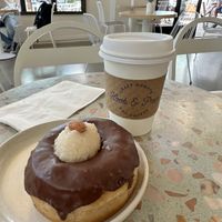 Almond Joy vegan donut and oat milk latte   at Hook and Press in Santa Barbara