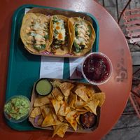 Nachos con guacamole, vegan tacos and agua de jamaica (around $900🤐) at La Milpa in Montevideo