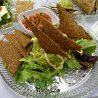 I love the nachos! Dehydrated chips, fresh guacamole, cashew sour cream, pico de gallo... yum yum! at Raw Intentions Kitchen in Broken Arrow