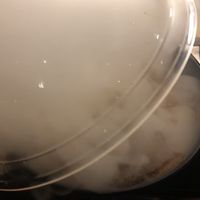 So exciting!  Removing the clear bowl holding the hardwood smoke inside   at REDWHITE BONELESS RAMEN - Studio City in Studio City