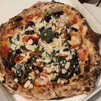Vegan margherita with friarielli, black olives, roasted peppers and almond flakes  at Sacro Dough Pizza in North West London