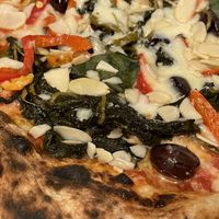 Vegan margherita with friarielli, black olives, roasted peppers and almond flakes  at Sacro Dough Pizza in North West London