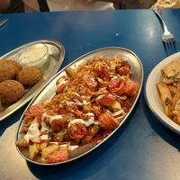 Croquetas,  falafel, salchipapas y pollo al ajillo at B13 Bar in Madrid