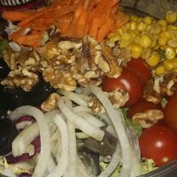 Salad with fresh vegetables and walnuts at B13 Bar in Madrid