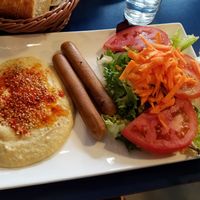"Sausage" with hummus and salad at B13 Bar in Madrid