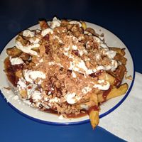 salchipapas (fries, salusage, mayonnaise and ketchup) at B13 Bar in Madrid