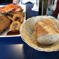 Seitan chicken burger with salad and onion rings at B13 Bar in Madrid