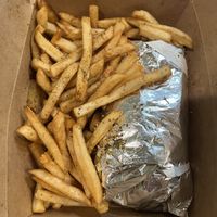 Huge serving of fries with falafel wrap  at Josef's Gyros & Kabobs in Appleton
