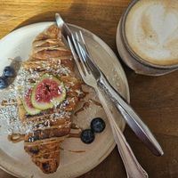 Grilled croissant with almond butter topping  & oat latte 🥰 at Soul's in Dusseldorf