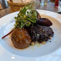 Roasted oyster mushrooms with confit tomato. Wild garlic and white beans. at Marle in Hook