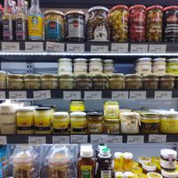 Variety of nut butters on second shelf from top at Bob's Red Mill in Tashkent