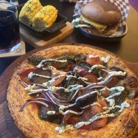 Vegan pan pizza, vegan cheese burger with corn (ordered vegan)  at Port Island in Hamburg