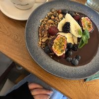 flat white with oatmilk and acai bowl    at Ewig Freunde in Berlin