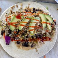 Thai Burrito with super-food add-on (sprouts, avocado, and walnuts) at Hippy Eats in Austin
