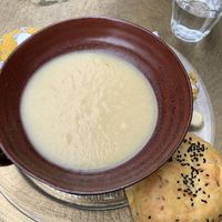 Vegan cauliflower cheese soup and a chickpea bun   at Chinty's in Keswick