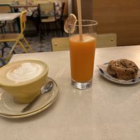 Oat Milk Cappuccino, juice, and a vegan cookie  at Matsa Caffè in Bordeaux
