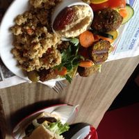 Two of the recent specials. Vegan delight salad (felafel, hummus, couscous, veggies, olives, pickles, lemon & a date) and vegan cheeze burger. Both excellent.  at CB1 Internet Cafe in Cambridge