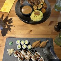 The “Grillteller” (super tasty!) and individually picked sushi: vegan duck inside-out roll, avocado maki and inari nigiri (also very good)  at AnTee Vegan in Hamburg