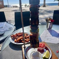 Grilled vegetables skewer and sweet potato friess  at Sam's Coffee and Bistro in Armacao De Pera