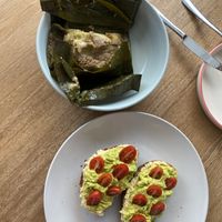Avocado hummus toast and tamal  at Valiente Café in Bogota