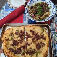 Mongolian beef pizza veganized and lion's mane mushroom lo mein with vegan pork at JenChan's in Atlanta