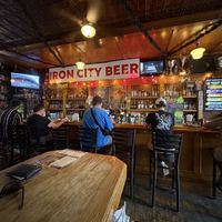 Small inside, but lots of character! A couple 2 and 4 seat tables, plus one large table in the back. Not much more to the place then what you see here!  at Ruggers Pub in Pittsburgh