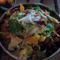 Nacho chorizo Mac & Cheese; house made seitan chorizo, smoked cashew cheese, pickled jalapeños, nacho crumbles, cilantro at Hella Vegan Eats in Oakland