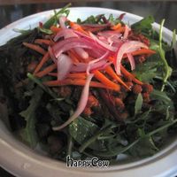 Salad with this really tasty tempeh topping and lemony vinaigrette. Mmmmm... at Hella Vegan Eats in Oakland