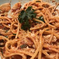 Vegan tomato garlic pasta with yeast flakes at Dobra Karma in Katowice