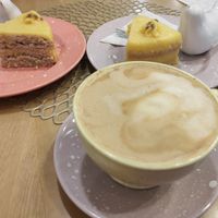 Coconut cappuccino and vegan passion fruit cake at Bakery Bites in Bogota