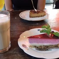 Vegan berry cheesecake in the front, with a soy chai latte. at Burgertrut in Rotterdam