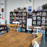 Inside of the cafe, showing their collection of board games at Common Meeple Board Game Cafe in Swansea
