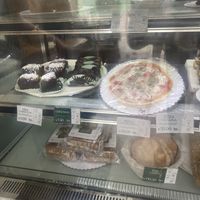 Pizza w/ cashew cheese and vegan desserts   at Madre Planta Cafetería in Lima