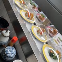 Sushi train offerings with vegan salmon   at Midori By Tao's   in Balwyn North