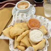Fried pizza dough and cappuccino with soy milk   at The King Caffè Letterario in Monopoli