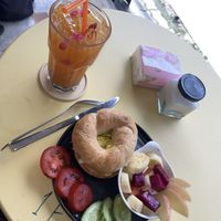 Passionfruit iced tea, avocado bagel and fruit salad  at Lemon Thyme Cafe in Pai
