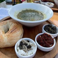 Lentil soup and bagel with different types of vegan toppings at Bagels & More in Ijsselstein
