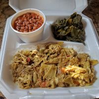 Coconut rice with banana blossom curry, black eyed pea stew, and collard greens at Afrobites in Little Rock