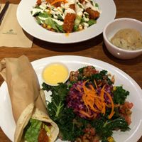 Buffalo mini wrap and  former menu items - All Hail Kale salad, B wing salad and cauli mash. at Next Level Veggie Grill - University Village in Seattle
