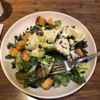 Caesar salad with lots of avocado and vegan parmesan  at Next Level Veggie Grill - University Village in Seattle